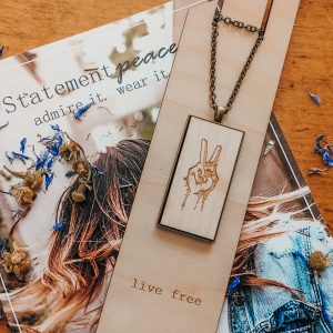 wood necklace with peace hands